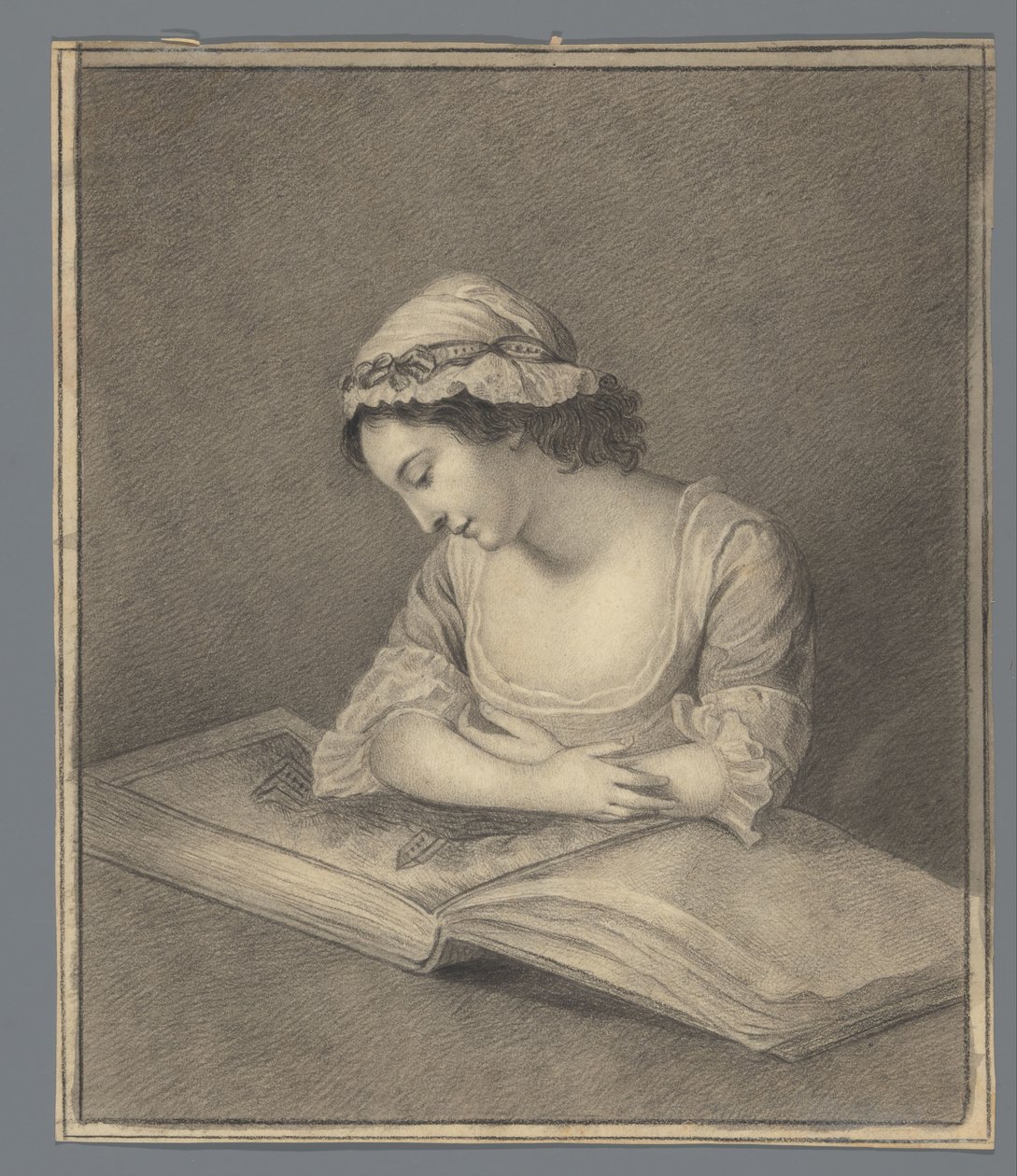 Mujer joven con libro ilustrado de Anonymous