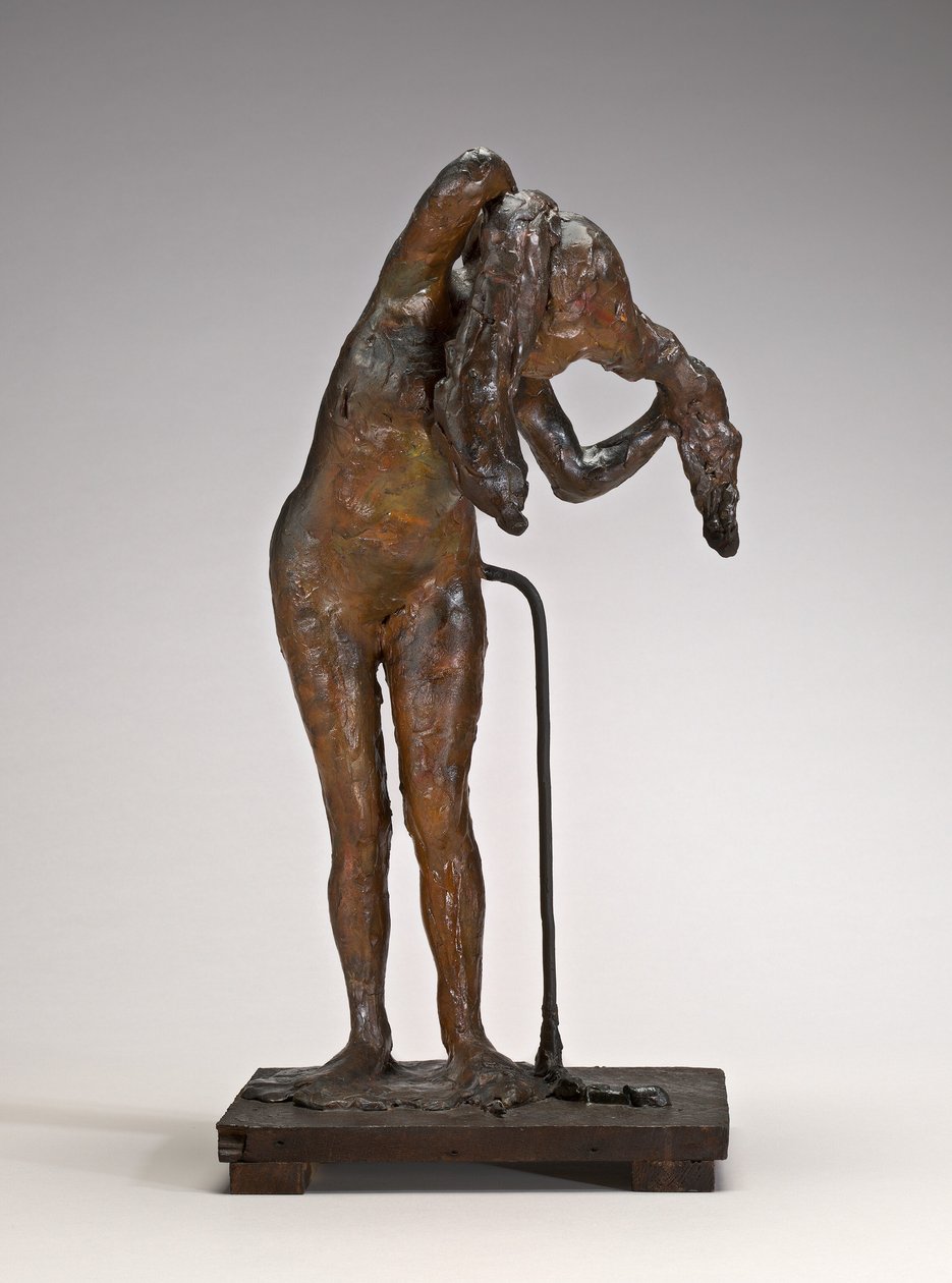 Mujer arreglándose el cabello de Edgar Degas