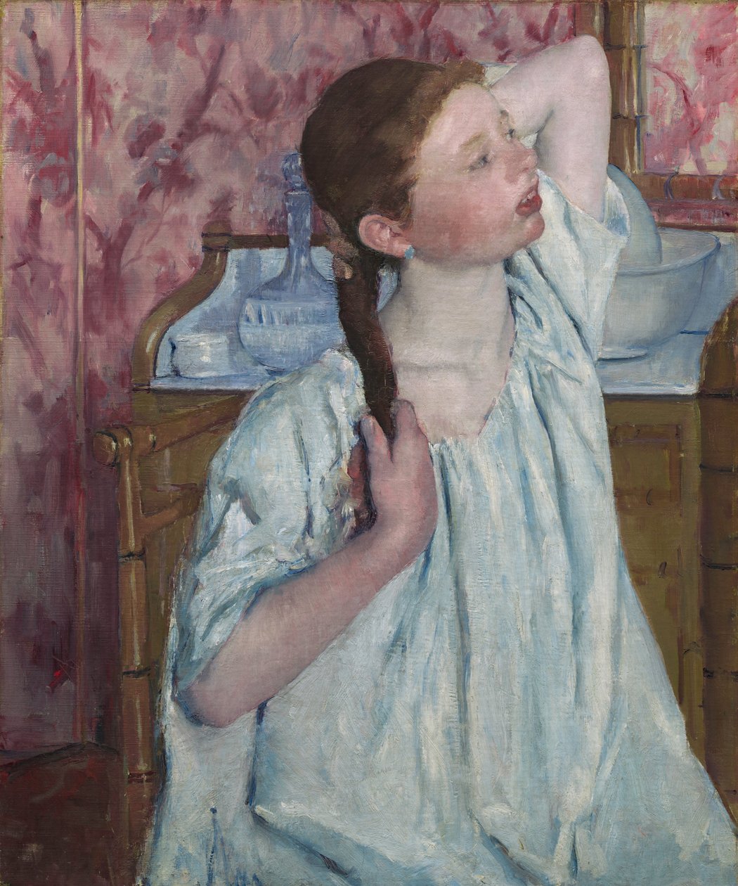 Niña arreglándose el cabello de Mary Cassatt