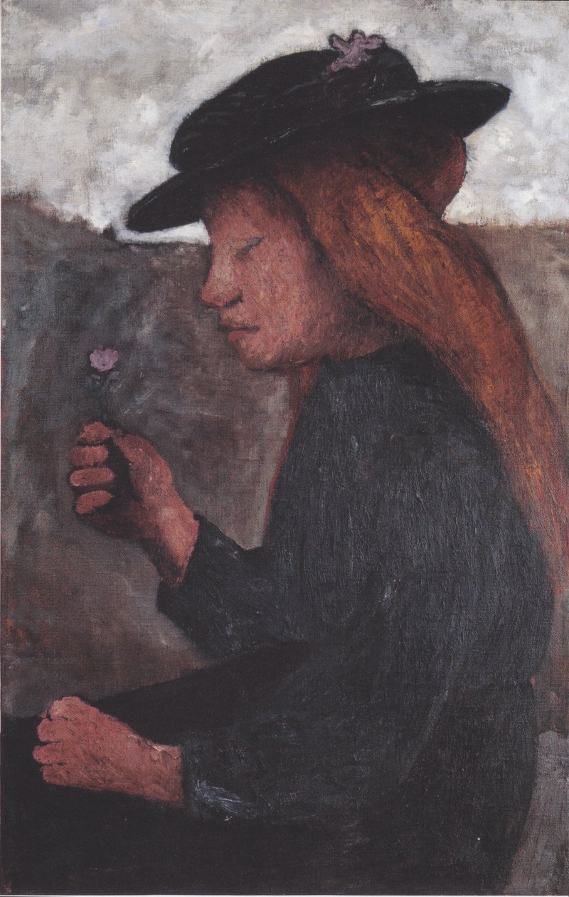 Niña sentada con sombrero negro y flor en la mano derecha de Paula Modersohn Becker