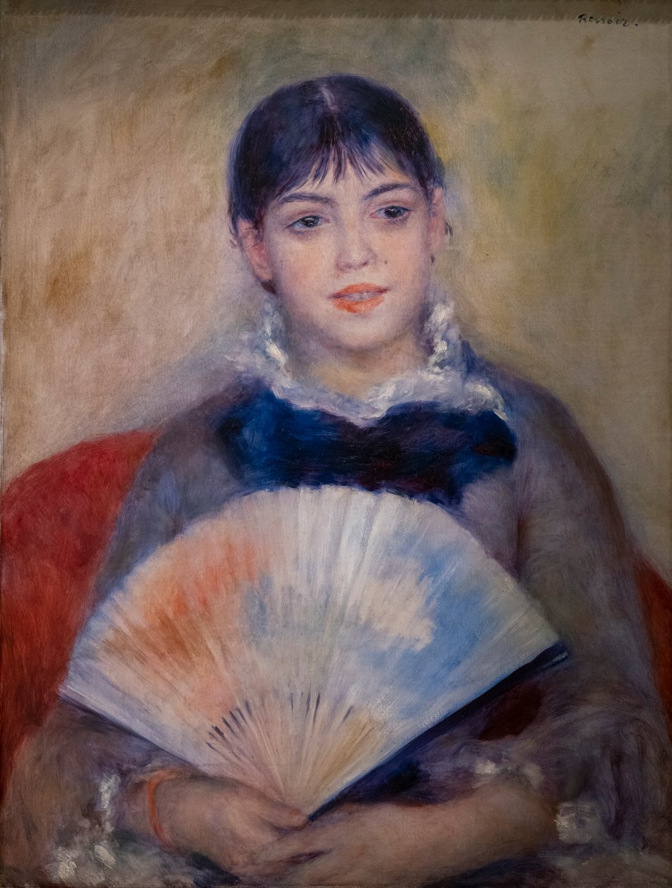 mujer joven con un abanico de Pierre Auguste Renoir