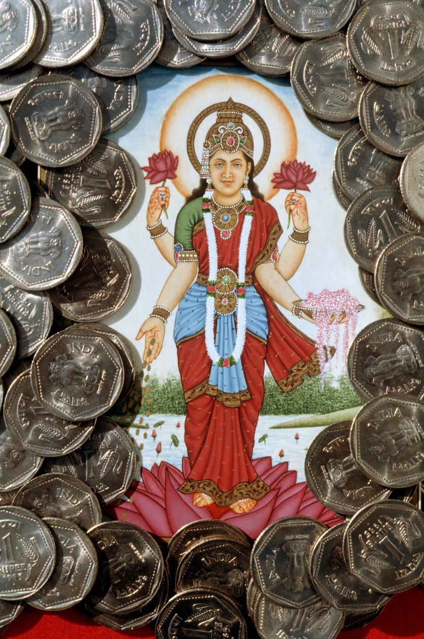 Diosa Lakshmi y monedas de una rupia de School Indian