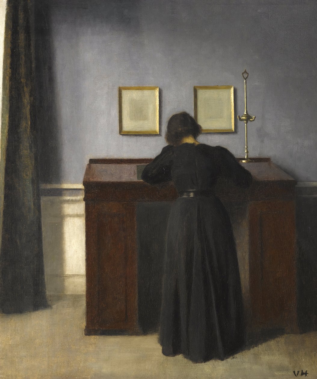 Ida de pie en un escritorio, 1900 de Vilhelm Hammershoi