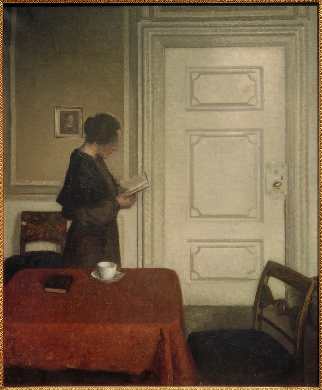 Mujer leyendo de Vilhelm Hammershoi